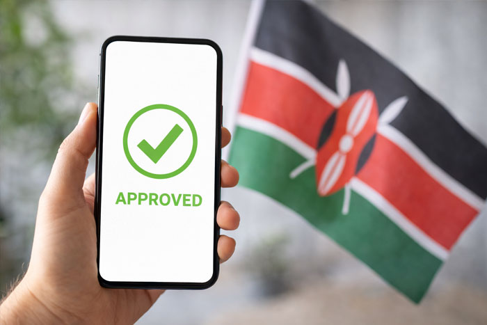 Approved Kenya eTA application on a smartphone with the Kenyan flag in the background